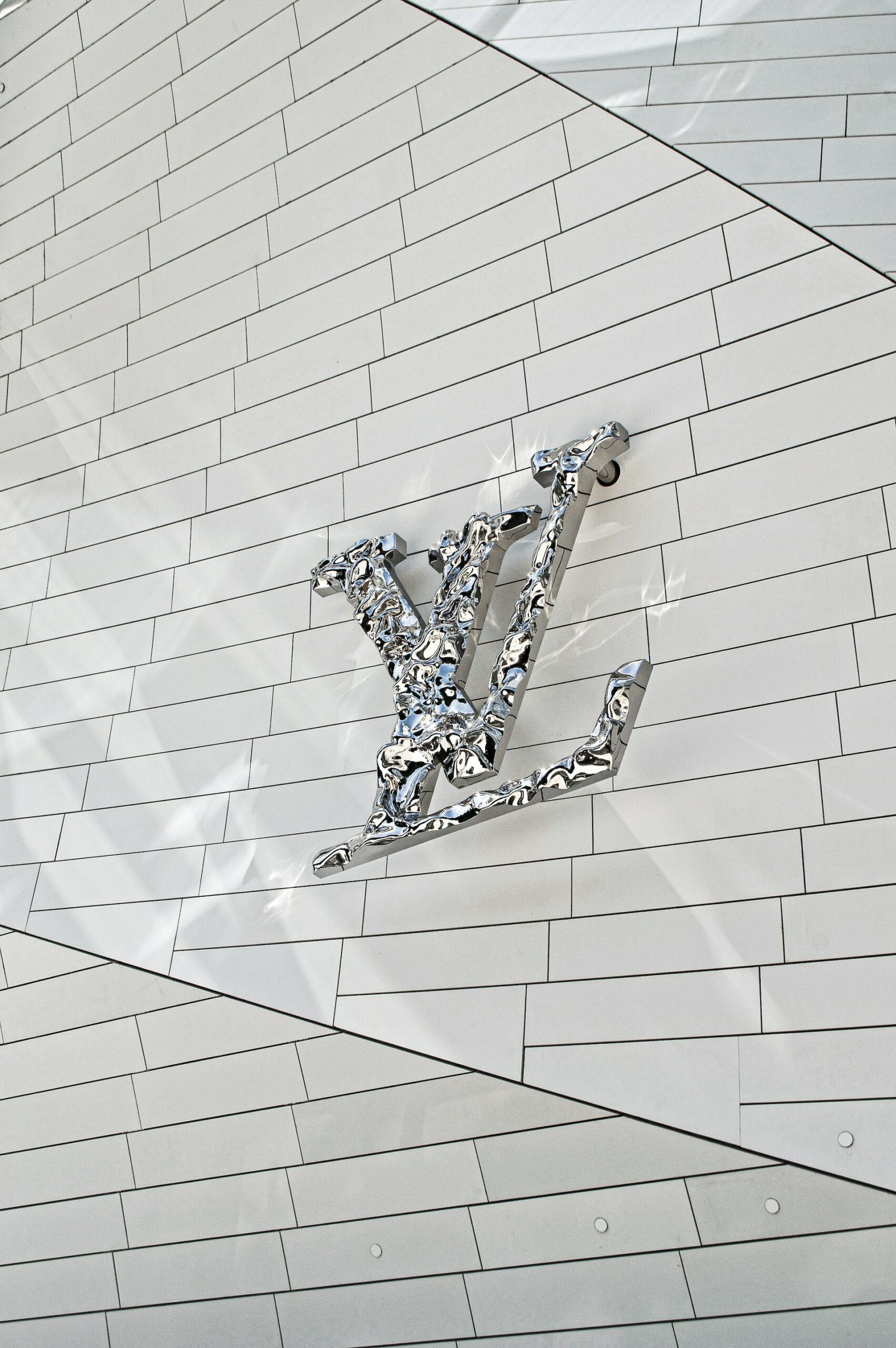 Luxury Louis Vuitton Big Logo In Classic White Monogram Background
