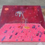 A vibrant, abstract painting in shades of pink and red, featuring a figure on a ladder surrounded by crosses.