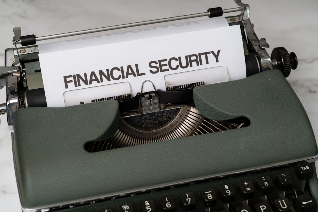 Vintage green typewriter with a sheet that reads 'financial security'.