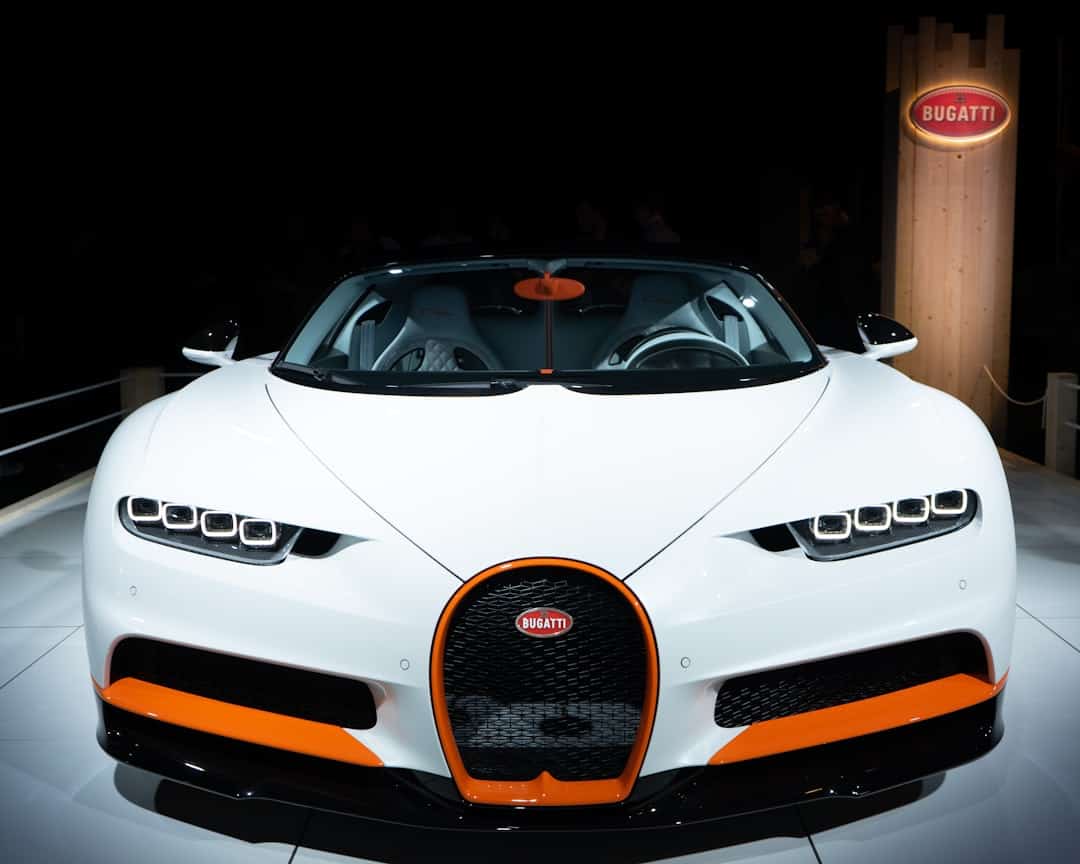 White Bugatti Chiron Super Sport with orange accents on display.