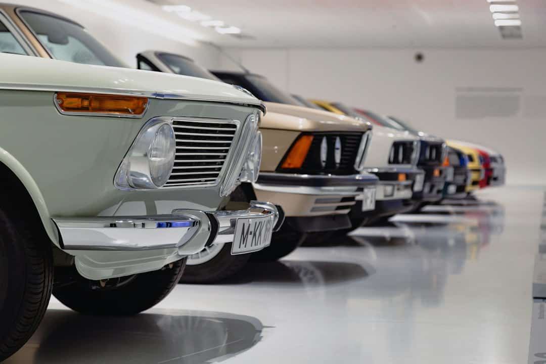 Lineup of vintage and classic cars in a showroom at Borro.
