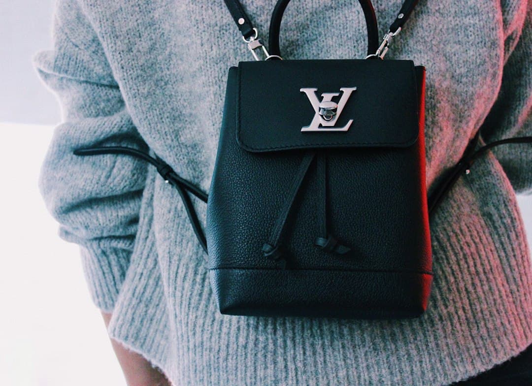 Louis Vuitton backpack with LV logo, stylish accessory for fashion lovers.
