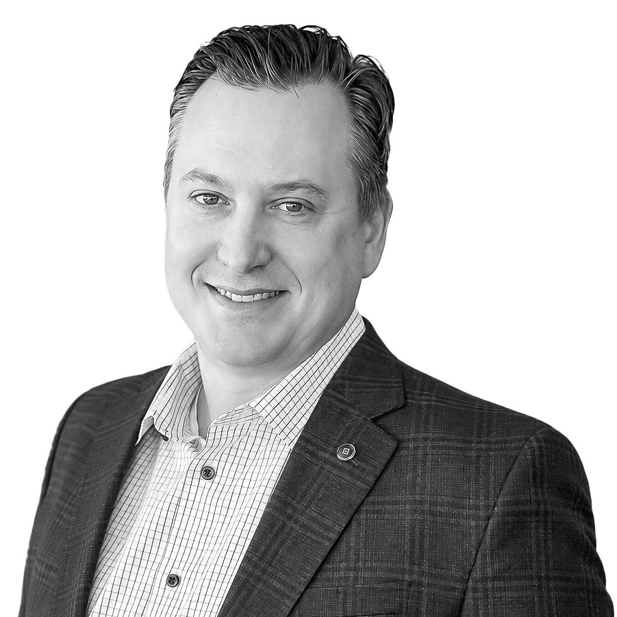 Portrait of a smiling man in a checkered shirt and blazer for Borro Company page.